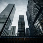 A view of some skyscrapers from below.