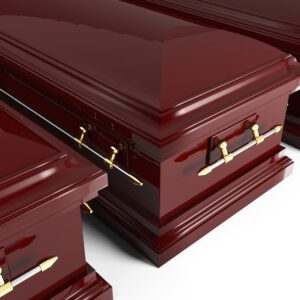 A group of three red caskets with gold handles.