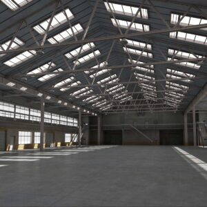 A large warehouse with lots of windows and lights.