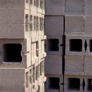 A building with many blocks of concrete in the corner.