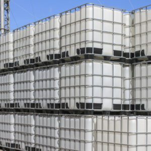 A stack of white plastic barrels on top of each other.