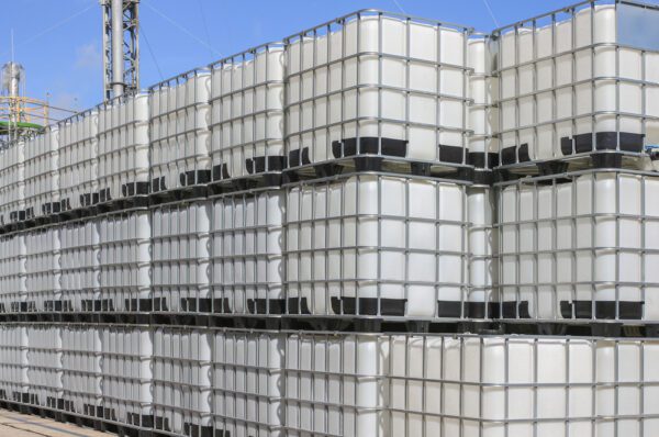 A stack of white plastic barrels on top of each other.