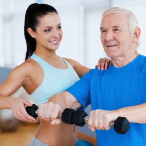 A woman and an older man are working out