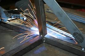 Metal welding with sparks flying.