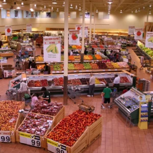 Supermarket produce section with colorful fruit